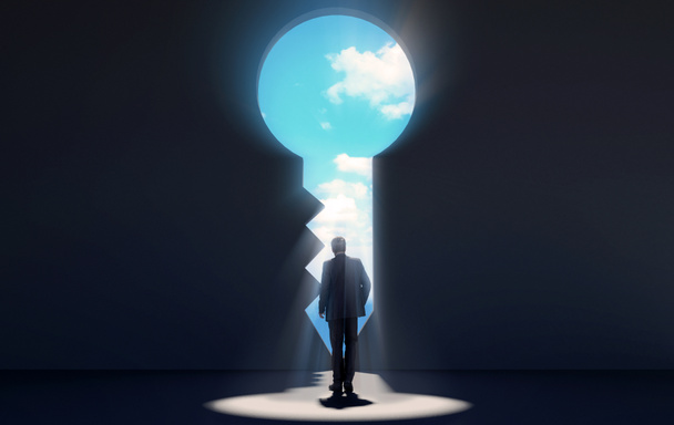 Businessman walking in dark room through key shaped door revealing blue sky for new opportunities, 3D rendering - Foto, Imagem
