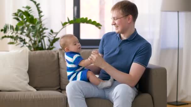 happy baby boy with father at home - Filmagem, Vídeo