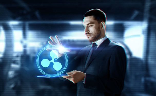 businessman with tablet pc and ripple hologram - Photo, Image