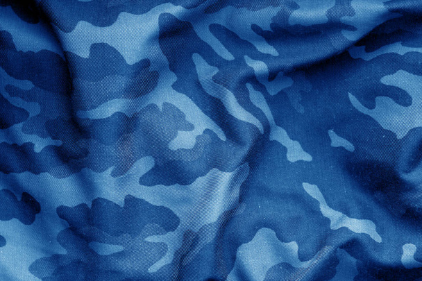 軍事制服パターンはぼかし青トーンの効果です。抽象的な背景とテクスチャー. - 写真・画像