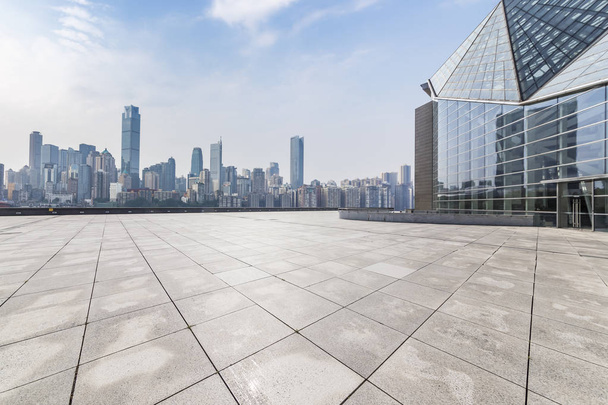Panoramic skyline and modern business office buildings with empty road,empty concrete square floor - Photo, Image
