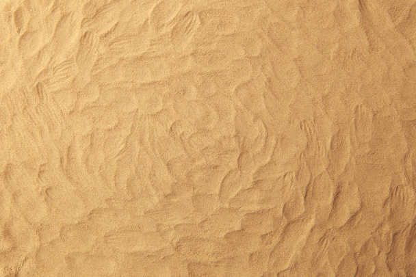 Sand texture background. Sand on beach with finger prints texture or pattern. - Foto, Bild