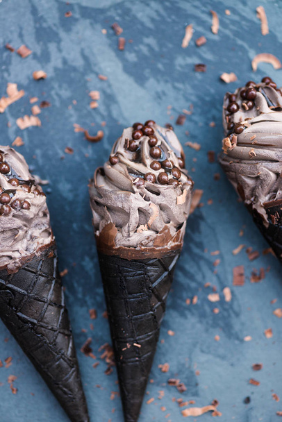 Double Chocolate Ice Creams with Black Waffle Cones on Dark Background - Photo, Image