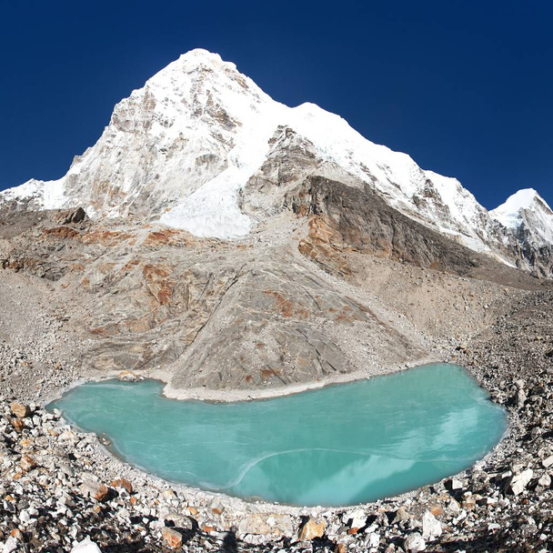 View of mount Pumori or Pumo Ri from Pumori base camp with frozen lake, Sagarmatha national park, Khumbu valley, Nepal Himalayas mountains - 写真・画像