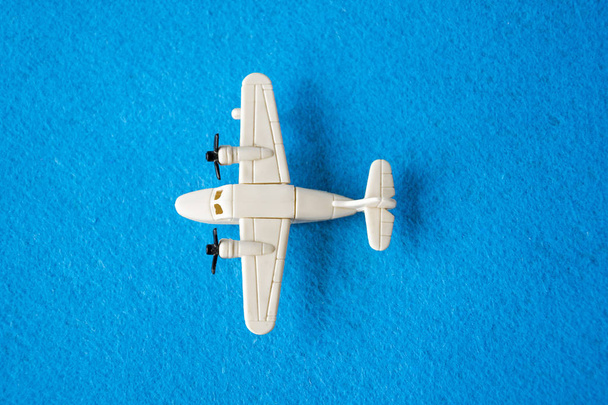 Toy aircraft toy isolated on blue backdrop - Photo, Image