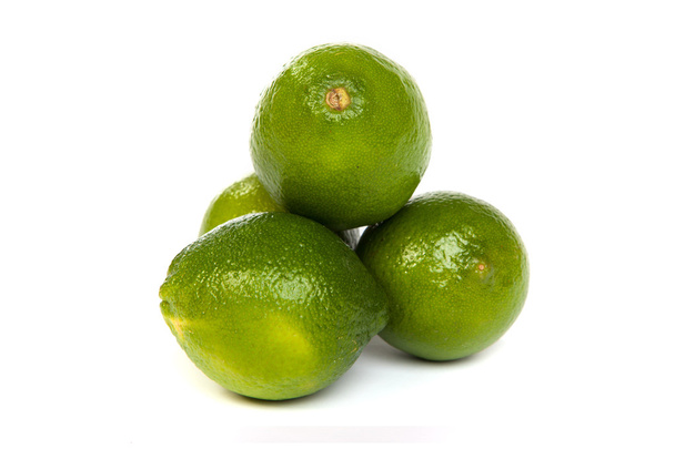 Group of whole limes and one half lime on white - Foto, Bild