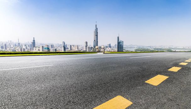 Panoramic skyline and buildings with empty road - Photo, Image