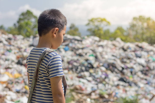Children stand to look at large trash to find the antique to sell, the concept of pollution and the environment,World Environment Day - Photo, Image