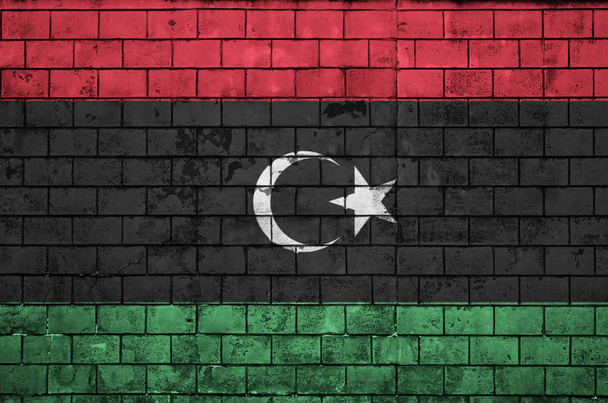 Libya bayrağı eski bir tuğla duvara boyalı - Fotoğraf, Görsel