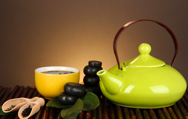 Chinese tea ceremony on bamboo table on brown background - Photo, Image