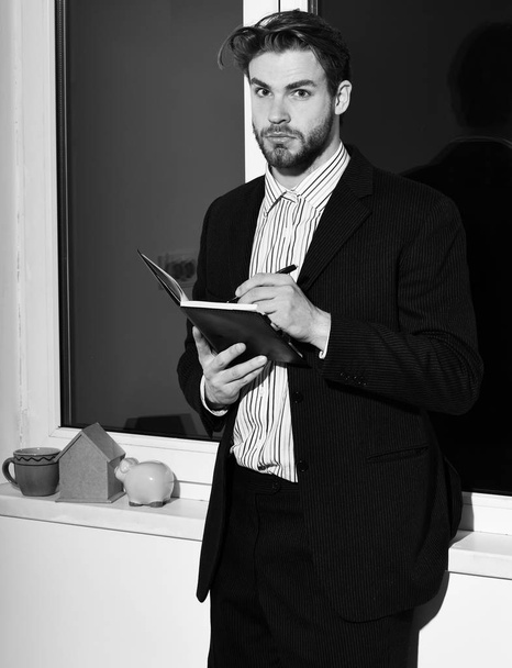 bearded businessman with notebook - Fotó, kép