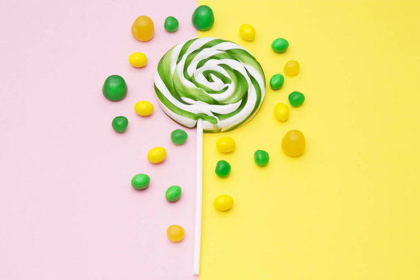 lollipops and colorful candies on backgrounds - Фото, зображення