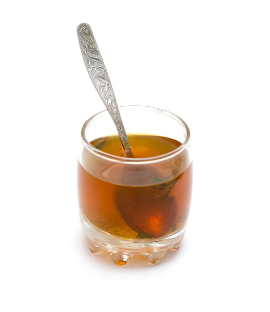 taza de té con una cuchara sobre un fondo blanco
 - Foto, imagen