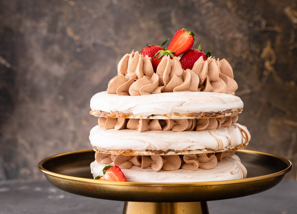 Pavlova cake with strawberry, chocolate.Festive atmosphere.Copy space. - Photo, image