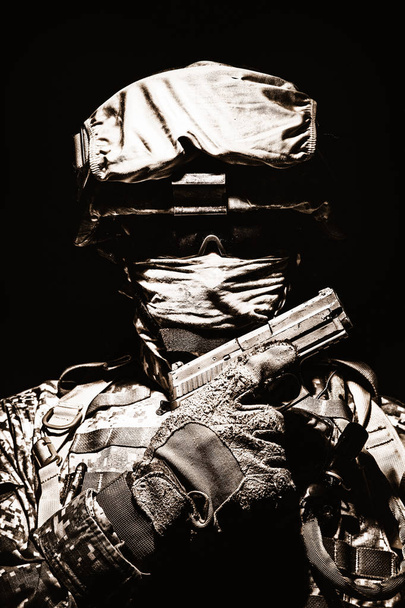 Portrait of commando with service pistol in hand - Photo, Image