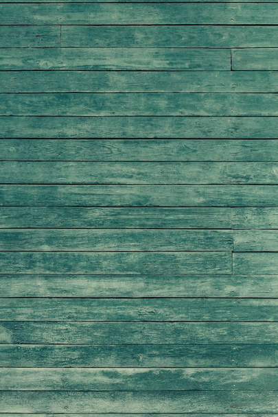 Old green toned shabby wooden planks with cracked color paint, vertical background - Foto, Bild