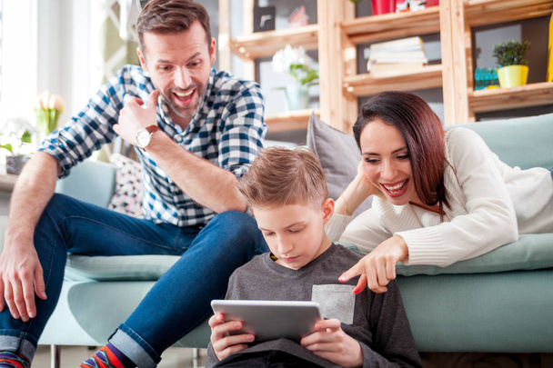 Young family using digital tablet at home - Foto, Imagem