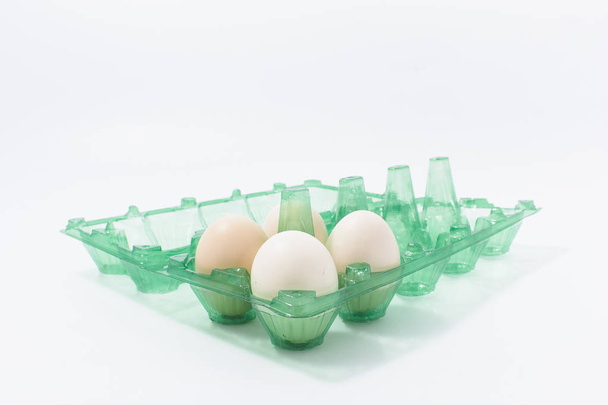 Eggs in a plastic package with isolated white background. - Photo, Image