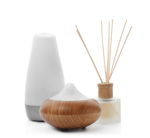 Different aroma oil diffusers on white background. Air freshening - Foto, imagen