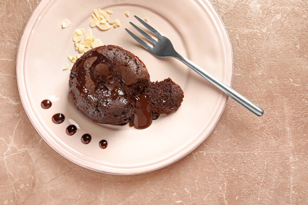 Plate of delicious fresh fondant with hot chocolate on table, top view. Lava cake recipe - Foto, Imagem