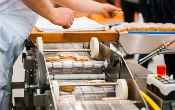 Close view of production line in confectionery factory - Foto, Bild