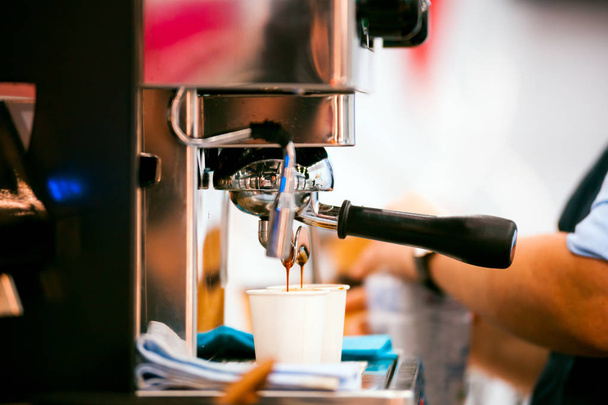Close view of espresso pouring from coffee machine - Fotoğraf, Görsel