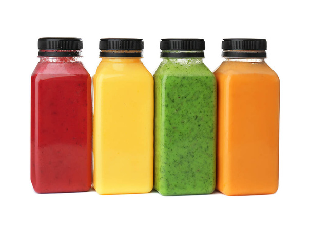 Bottles with delicious detox smoothies on white background - Foto, imagen