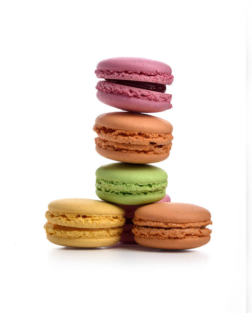 Pyramid of multi-colored macaroons isolated on white background - 写真・画像