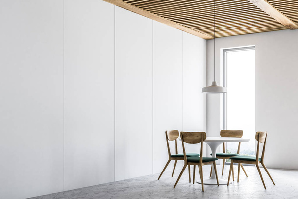 Corner of a white dining room with a concrete floor, narrow window and a round table with chairs standing near it. 3d rendering mock up - Photo, Image