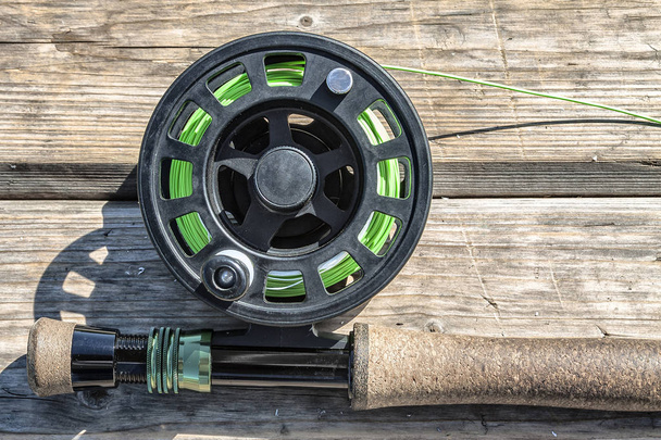 fishing rods with reels for fly fishing on a wooden stand - Foto, immagini