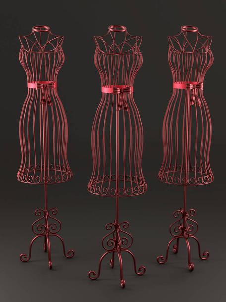 Maniquíes elegantes de tres sastres de alambre rojo sobre fondo marrón oscuro
 - Foto, imagen