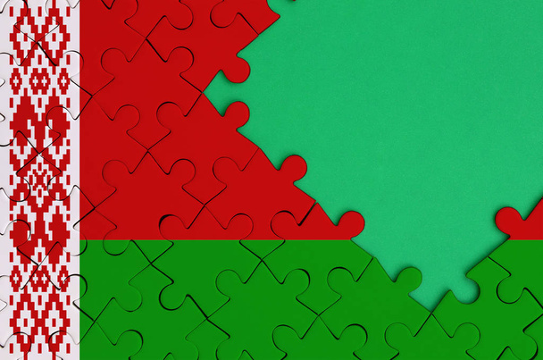 Bandeira da Bielorrússia é representado em um quebra-cabeça completo com espaço livre cópia verde no lado direito
. - Foto, Imagem