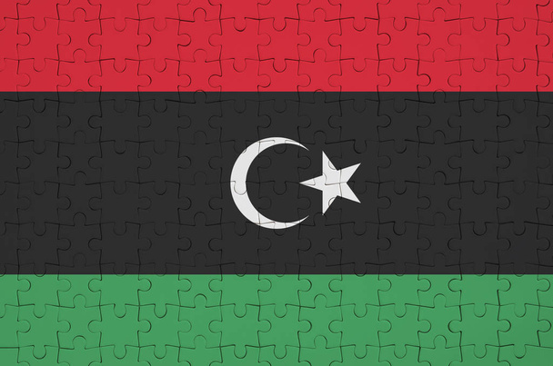 Σημαία της Λιβύης απεικονίζεται σε ένα διπλωμένο παζλ - Φωτογραφία, εικόνα
