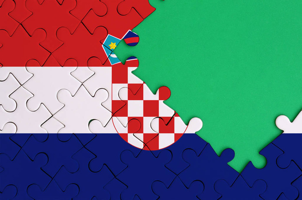 Bandeira da Croácia é representado em um quebra-cabeça completo com espaço livre cópia verde no lado direito
. - Foto, Imagem