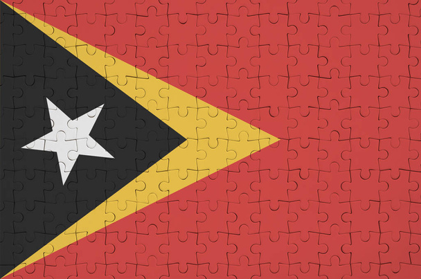 timor leste flag ist auf einem gefalteten Puzzle abgebildet - Foto, Bild