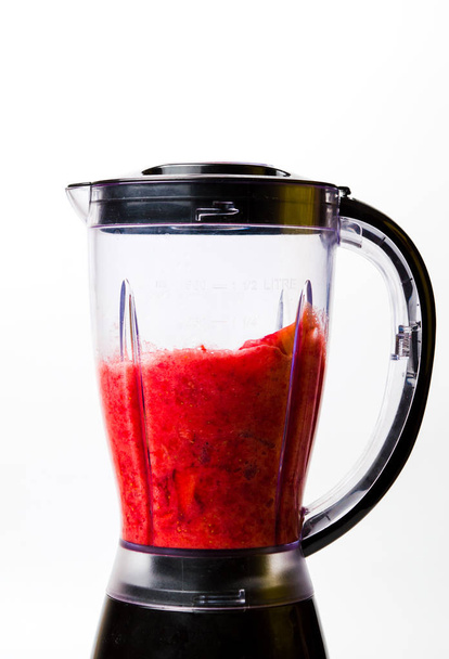 Strawberry smoothie blending in a blender isolated - Photo, Image