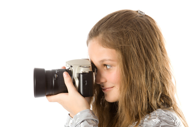 Молодая девушка с камерой SLR
 - Фото, изображение