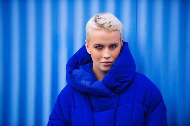 Portrait of young beautiful woman with short hairs - Influencer posing for a fashion advertising campaign - Zdjęcie, obraz