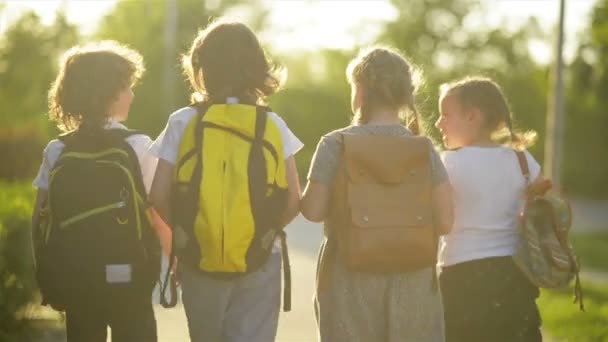 Four Friends Are Going to School. They Have A Lot of Fun Because Today is Their First Day at School. - Záběry, video