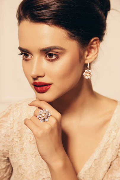 fashion studio photo of beautiful young woman with dark hair and perfect glowing skin, in elegant dress and jewelry - Φωτογραφία, εικόνα