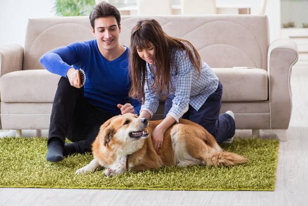 Happy family with golden retriever dog - Foto, imagen