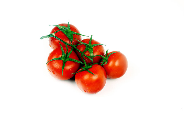 branch of red tomatoes on a branch with drops of dew on a white background - Fotoğraf, Görsel