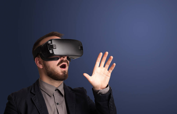 Businessman with virtual reality goggles - Фото, зображення