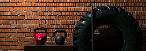 set of sports equipment for cross-training on the background of a brick wall - Zdjęcie, obraz
