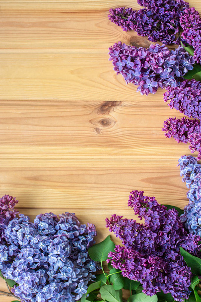Beautiful lilac on a wooden background, white - Фото, зображення