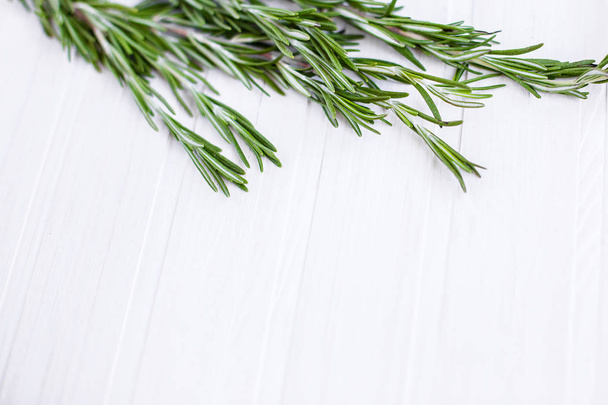 background bouquet rosemary on a wooden table - 写真・画像