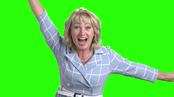 Excited mature woman on green screen. - Footage, Video