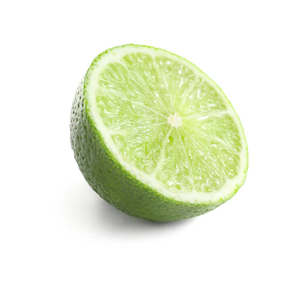 Half of fresh ripe lime on white background - Valokuva, kuva