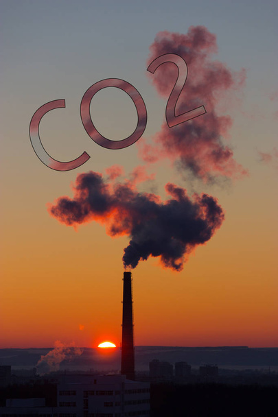 Smoke of chimney writing CO2 in the sky - Φωτογραφία, εικόνα
