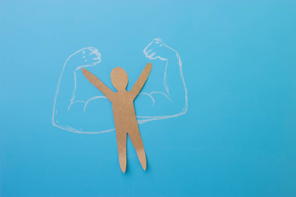 paper man with muscles. self confidence concept - Fotoğraf, Görsel